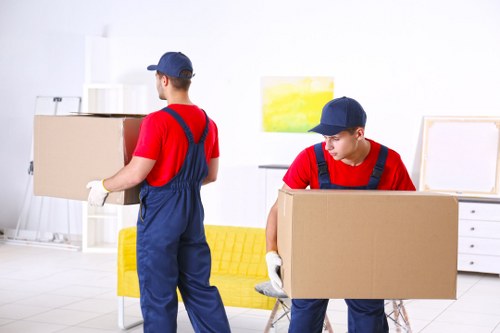 Man and van moving boxes and furniture in Hounslow residential street