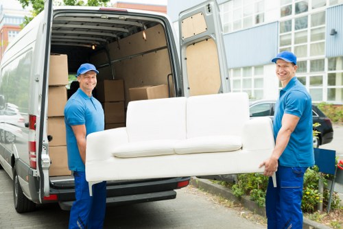 Moving team supporting a house removal in Hounslow with packed boxes and furniture