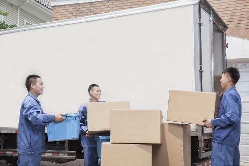 Removal van and moving boxes in a Hounslow residential street