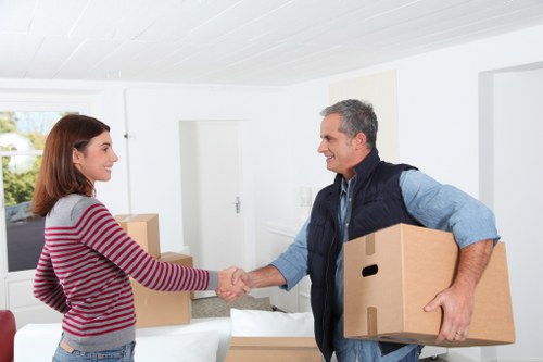 Packed boxes and furniture ready for loading during a local move