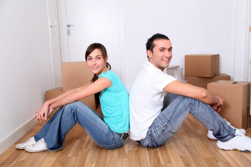Moving boxes and household items being organised for transport