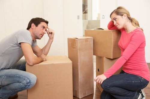 Home removals team handling furniture in a flat move